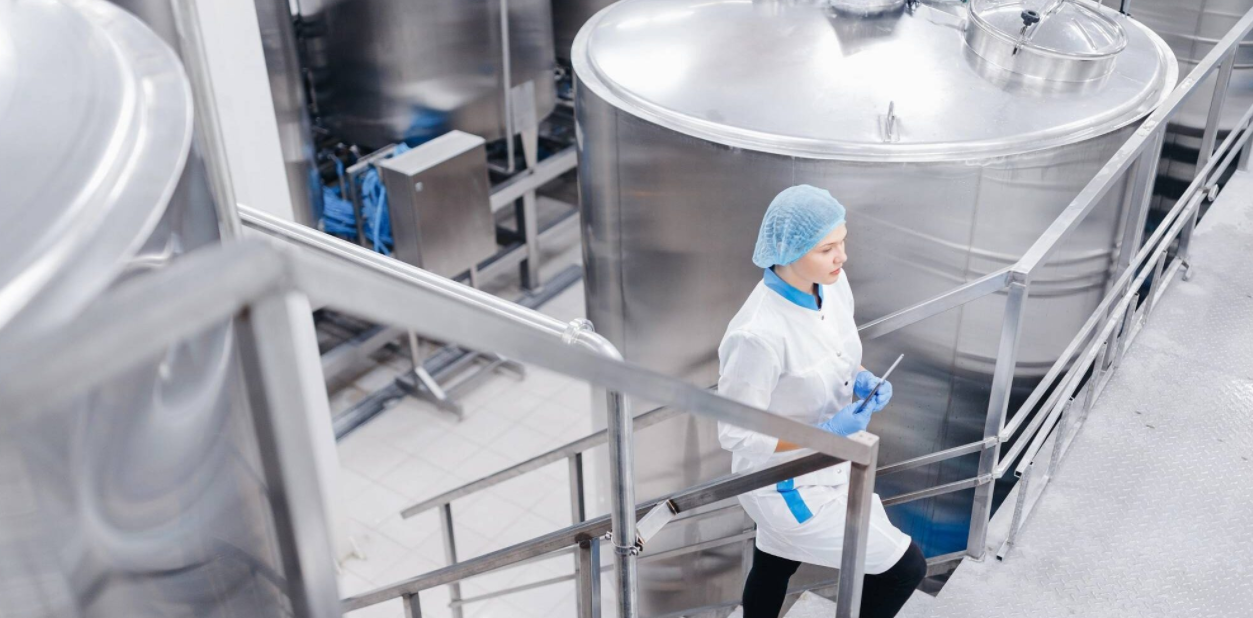 Industrial cleaning crew preparing equipment in a large facility